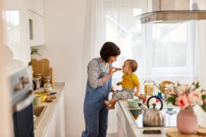 Mother,Feeding,Baby,Boy,In,The,Kitchen